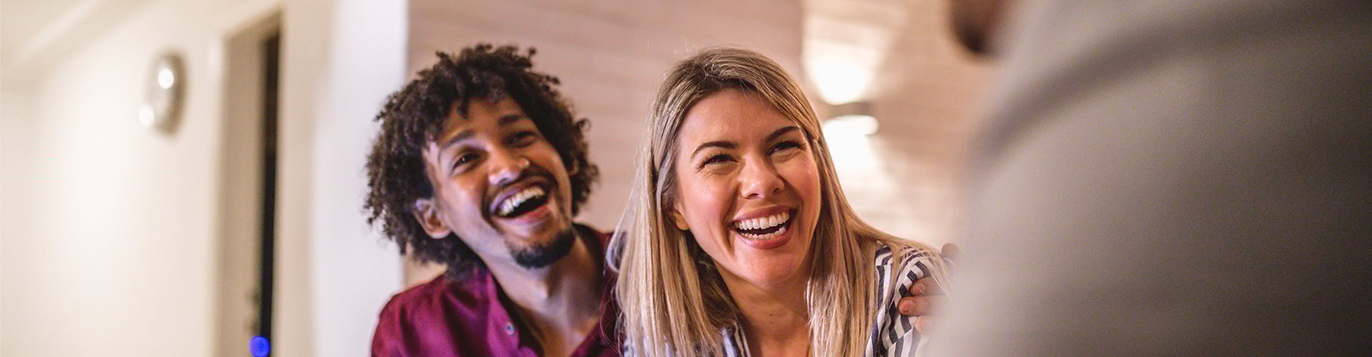 A man and woman laughing.