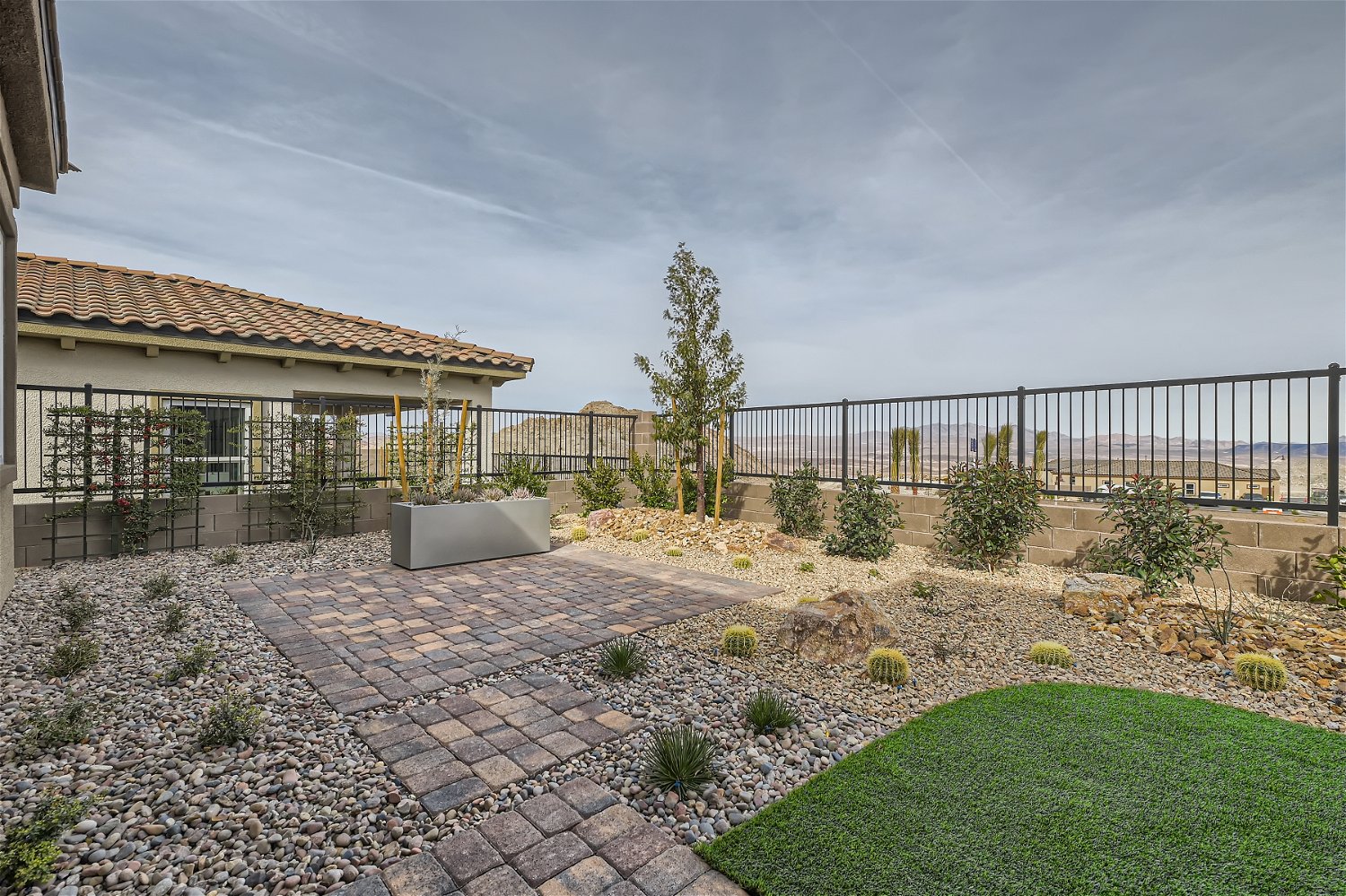 A garden in front of a house.