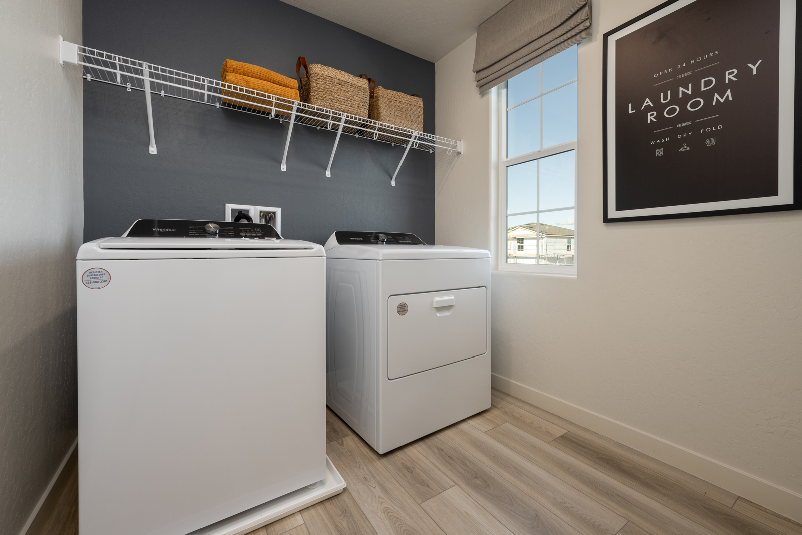 A laundry room with a washer and dryer.