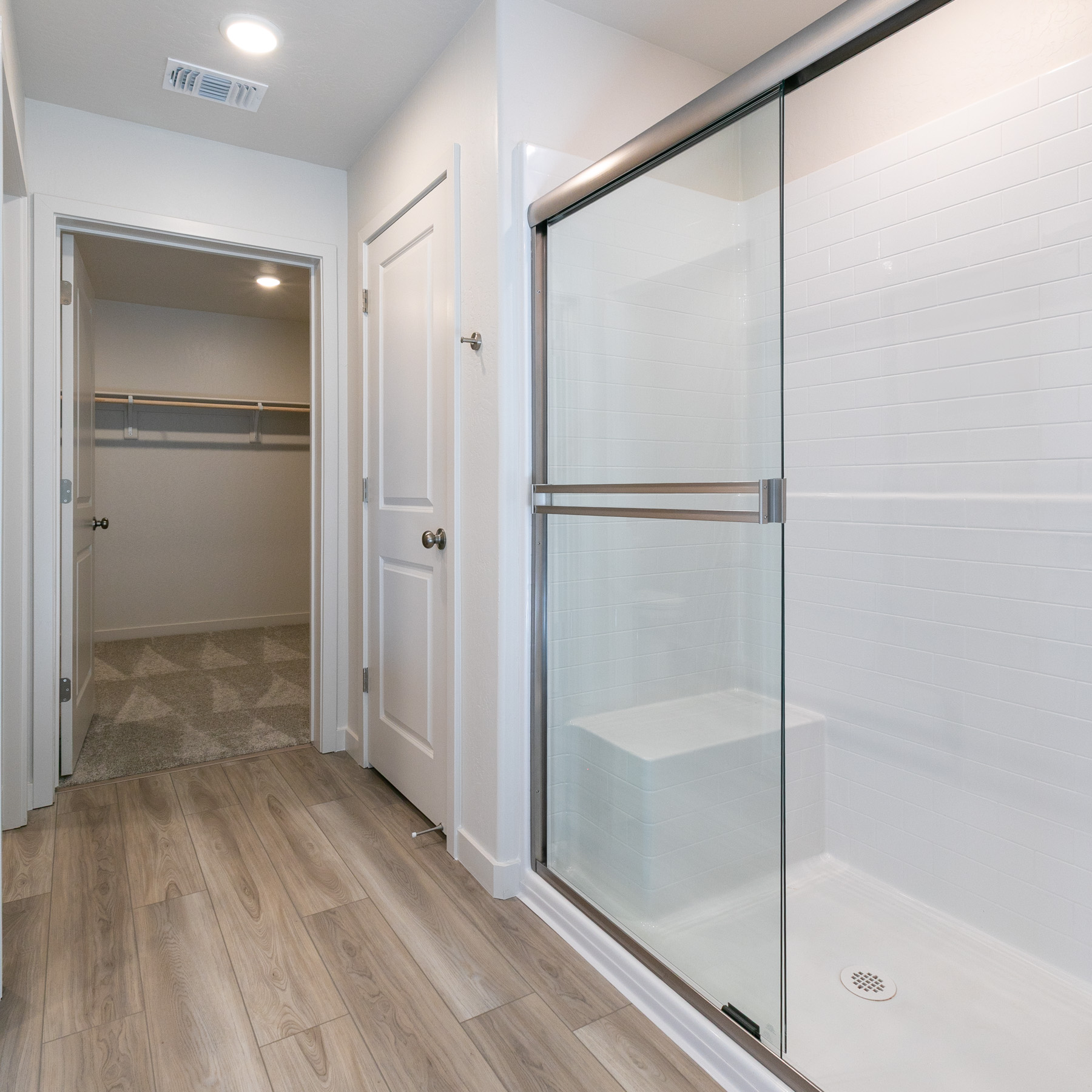 A bathroom with a glass shower.