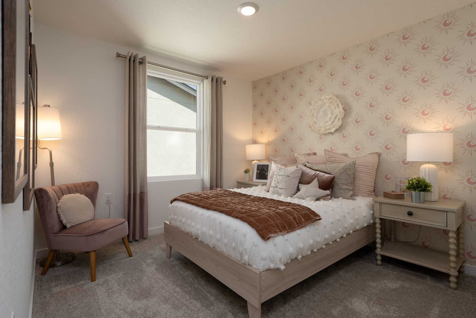 A bedroom with a bed and a chair.