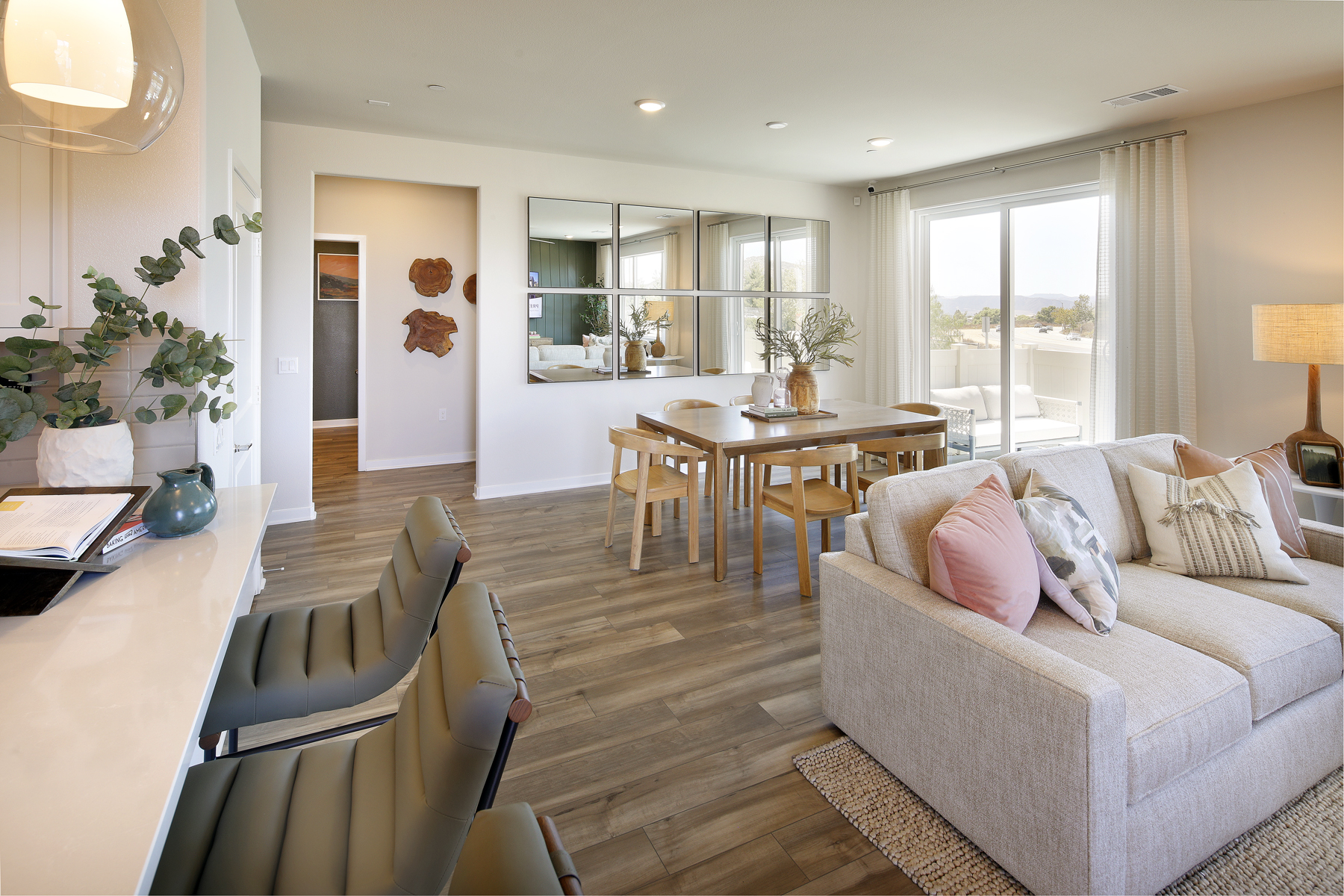 A living room with a wood floor.