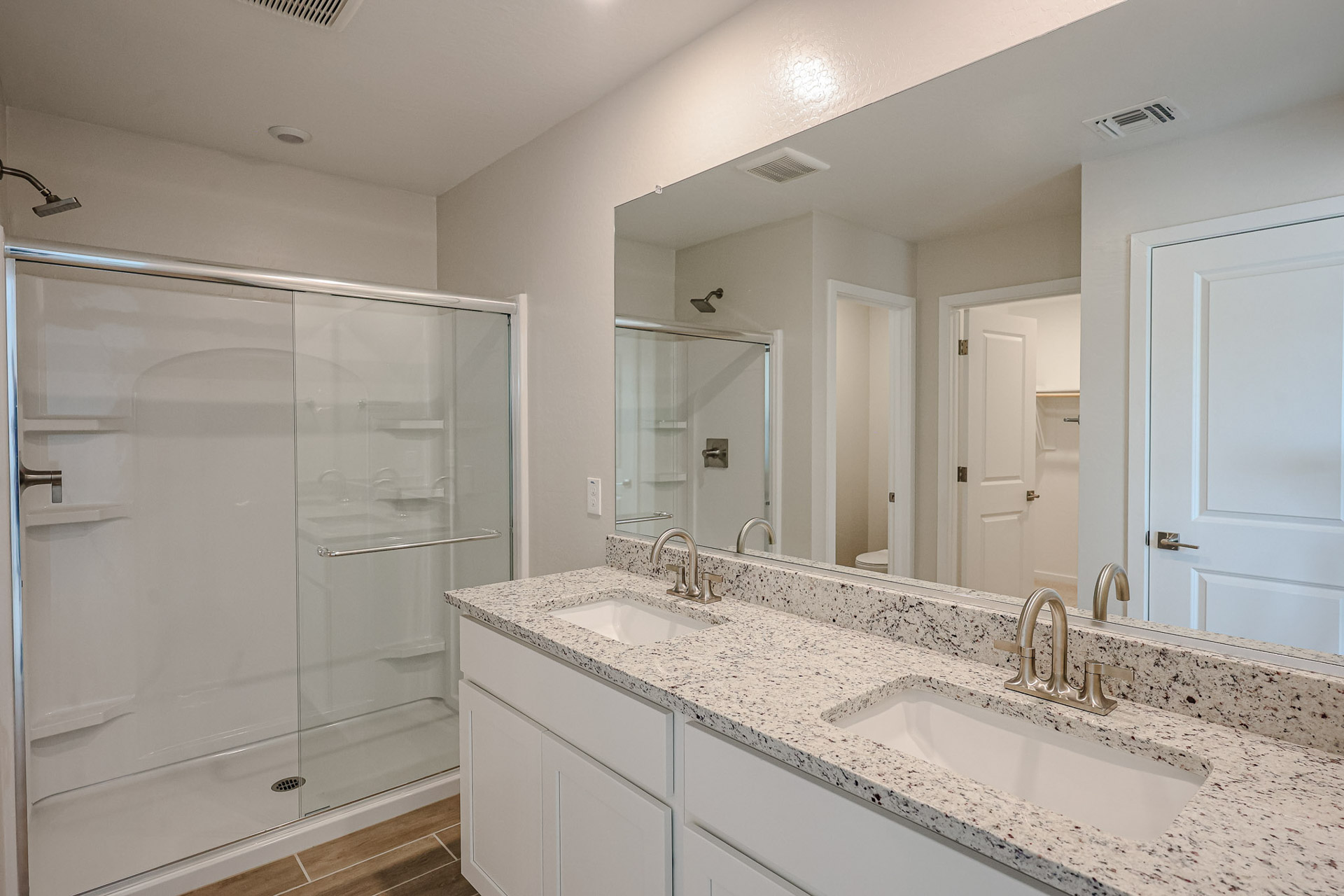 A bathroom with a glass shower.