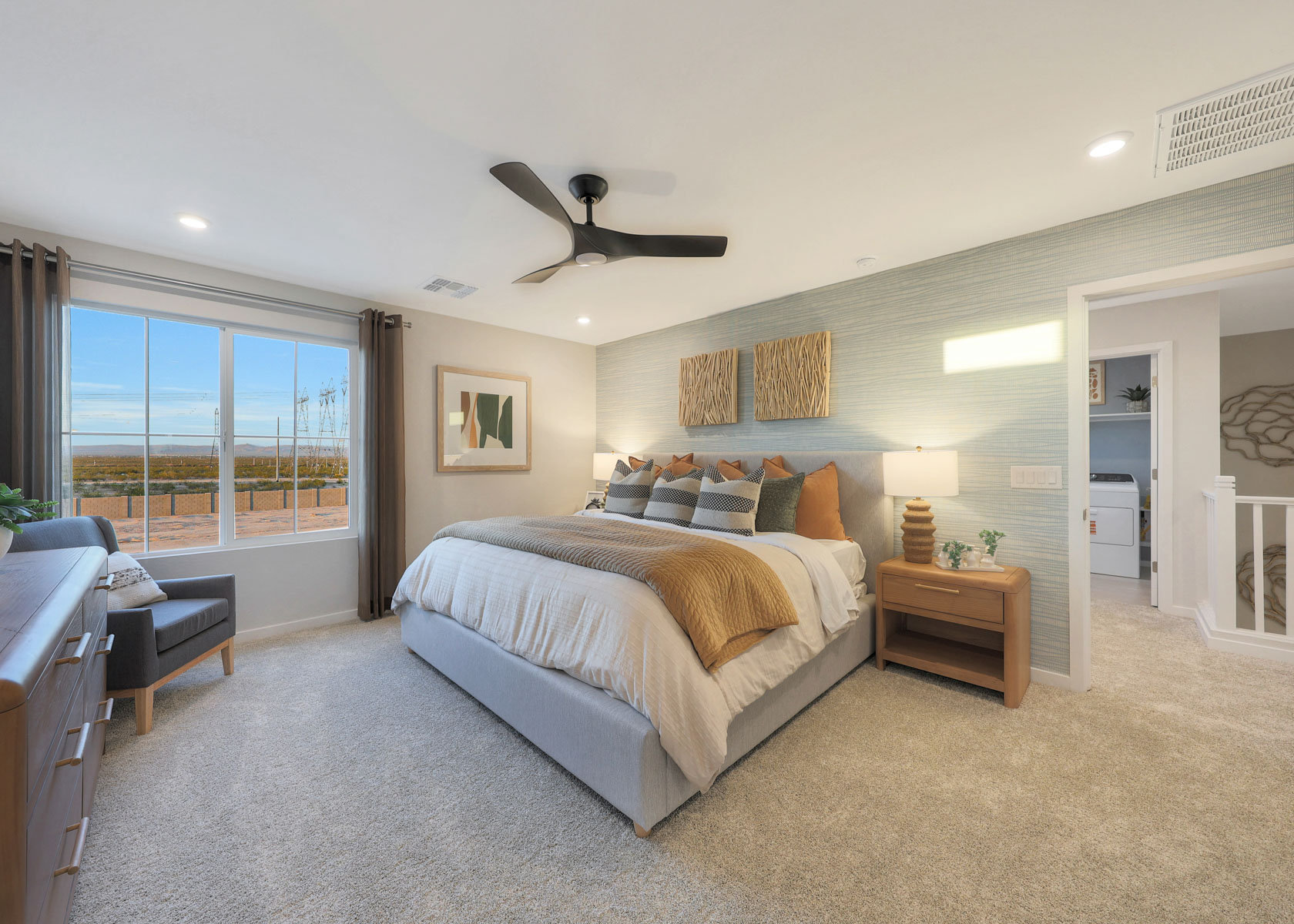 A bedroom with a large bed.