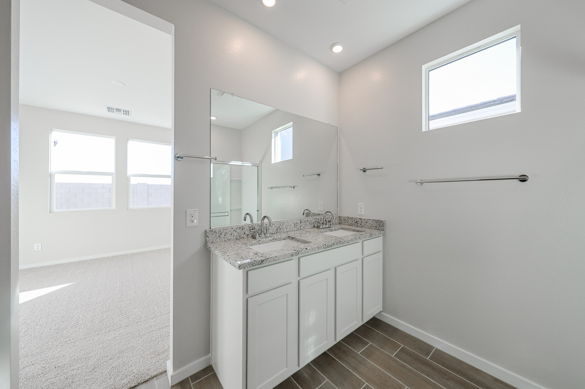 A bathroom with a marble countertop.