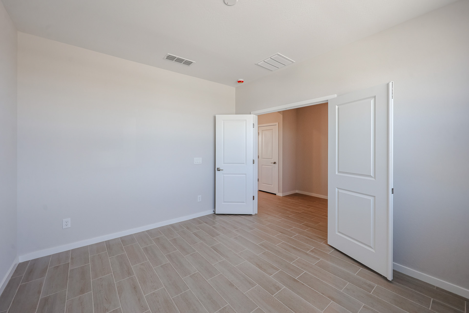 A room with white doors.