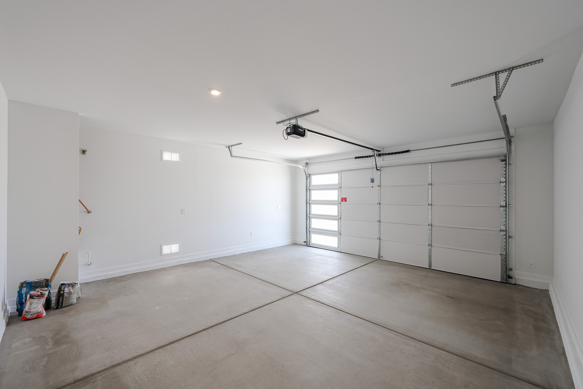 A room with white walls and a wood floor.