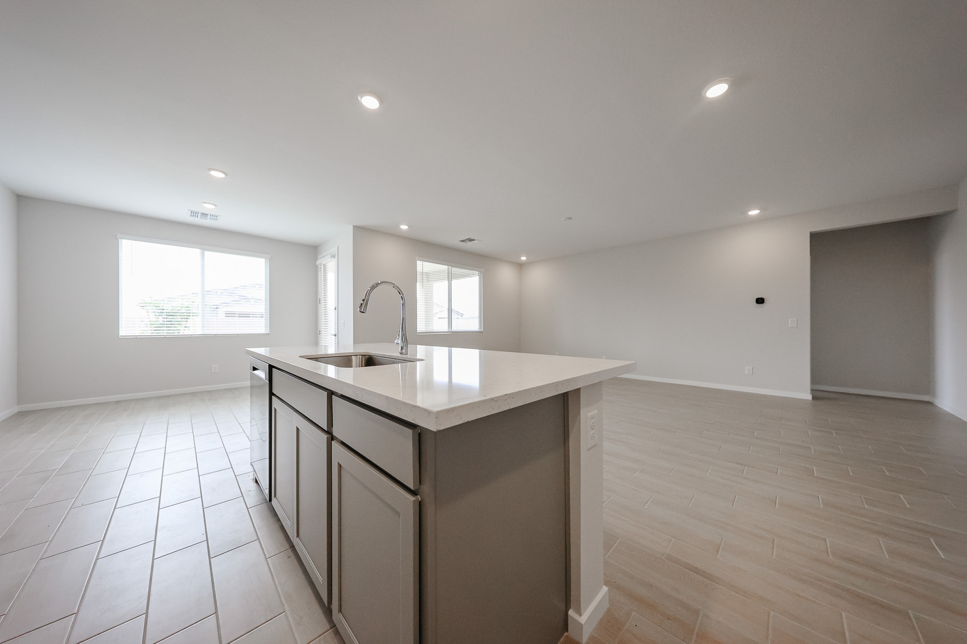 A kitchen with a wood floor.