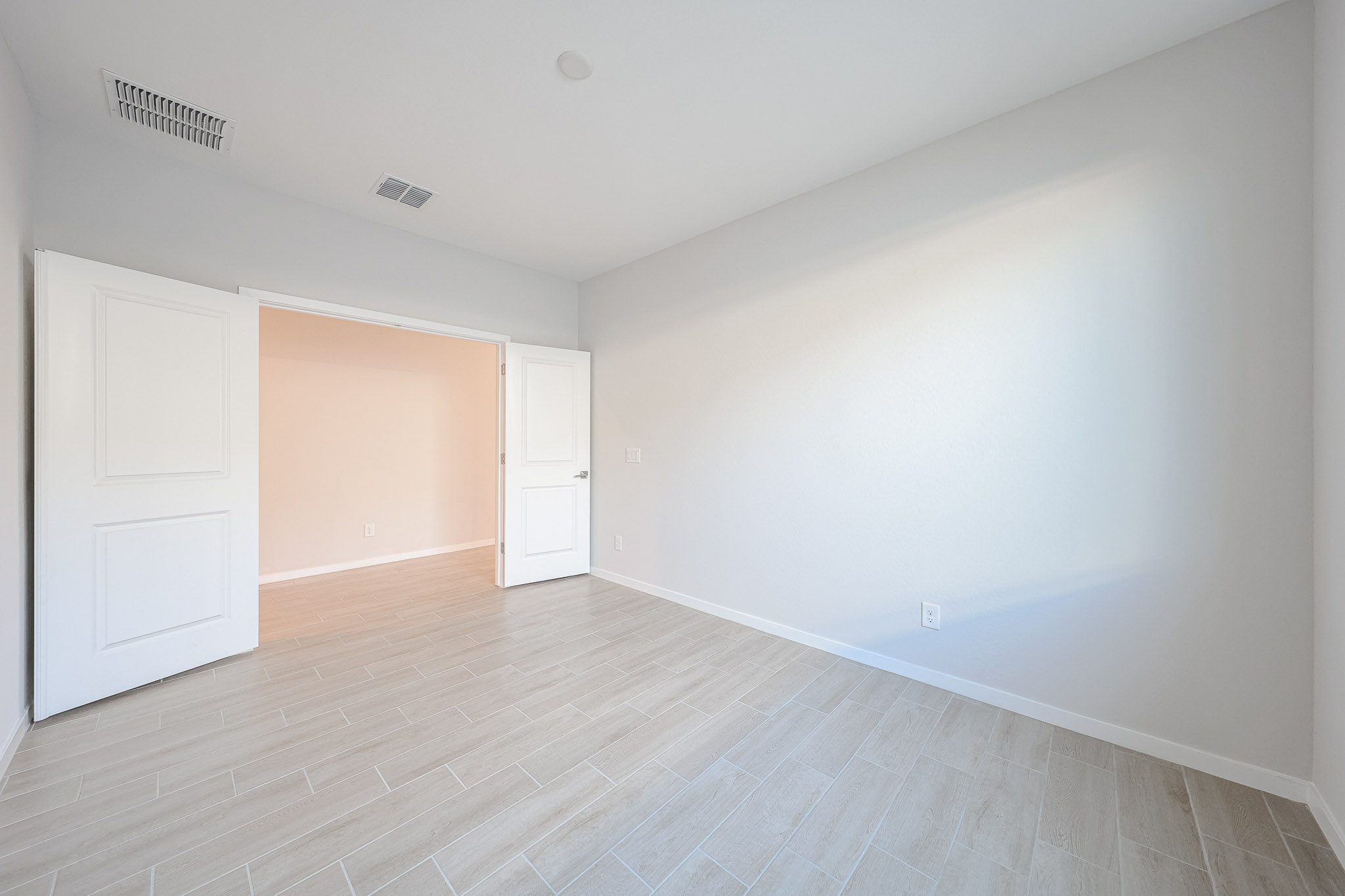 A room with white doors.