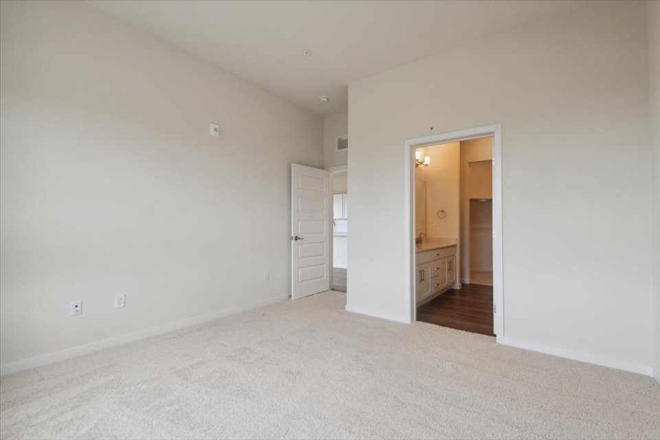 A hallway with white walls.