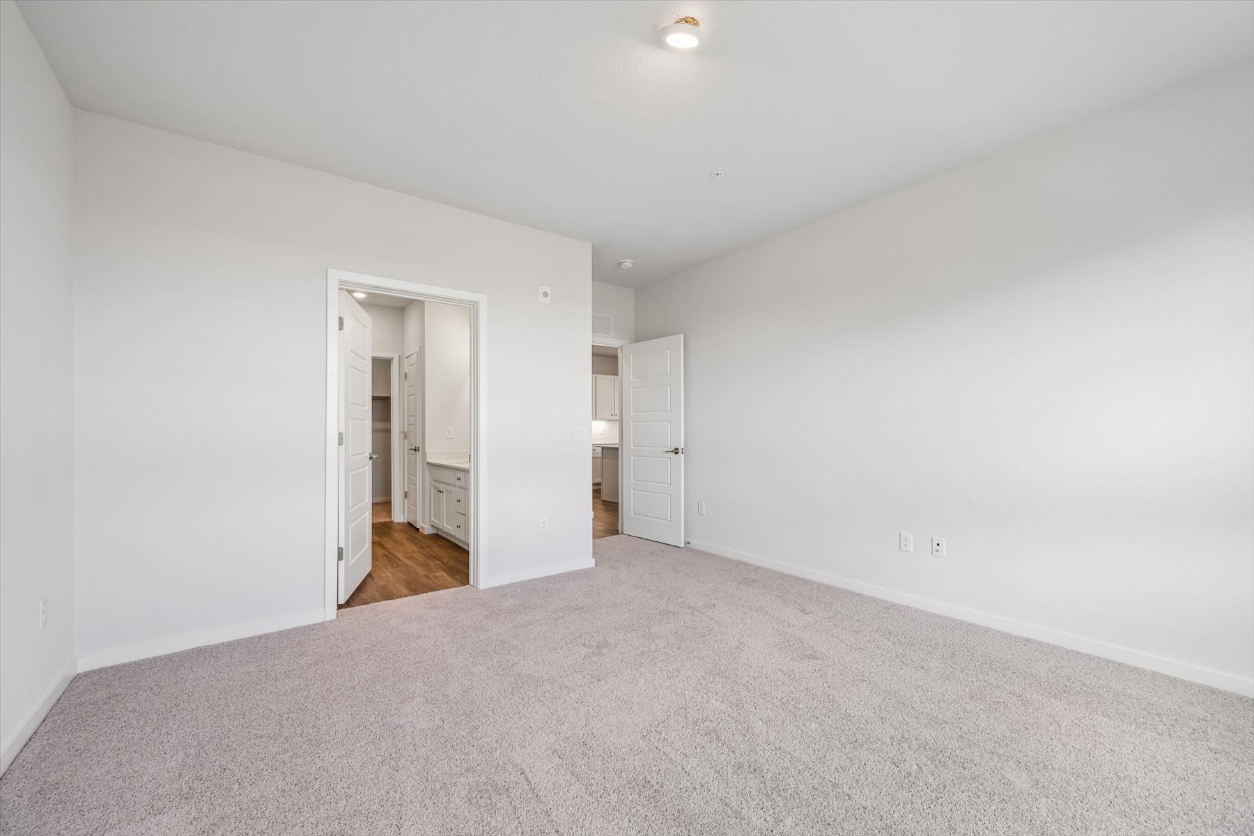 A hallway with white walls.