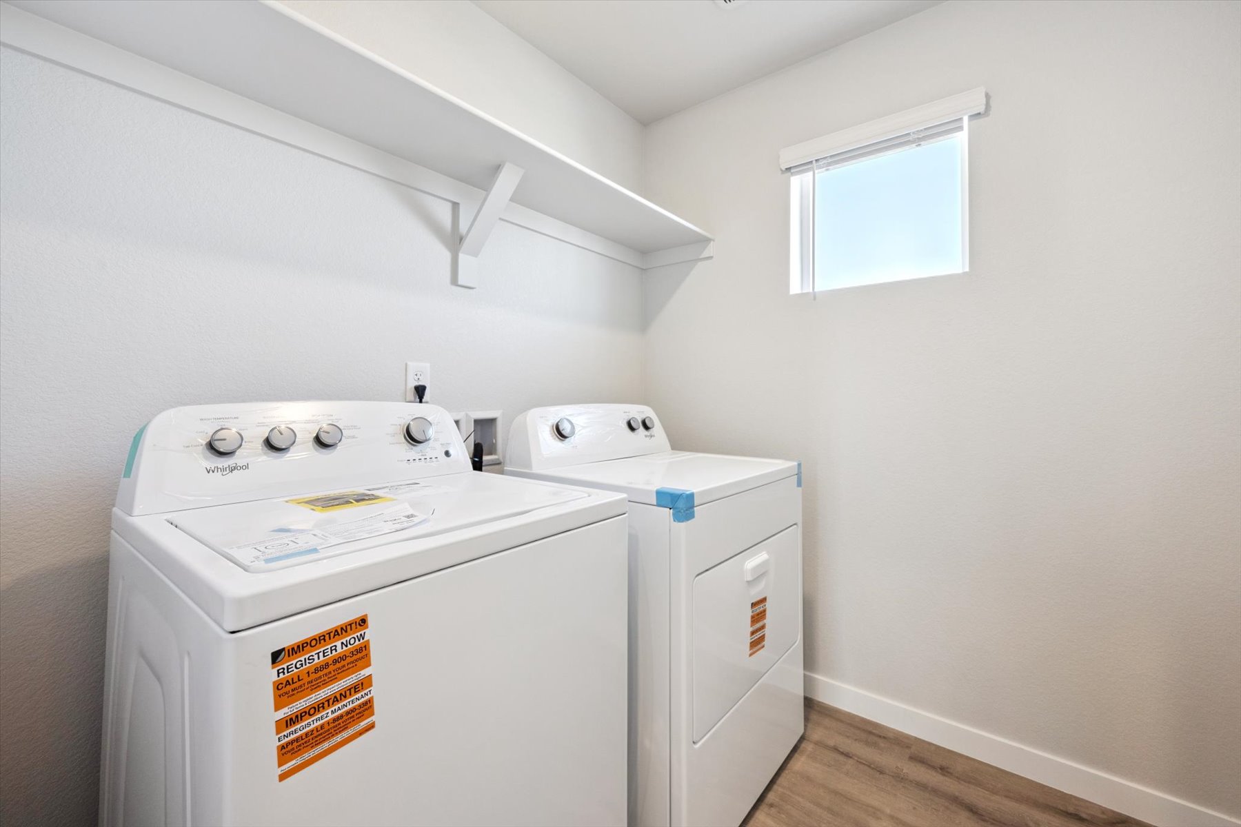 A washing machine in a room.