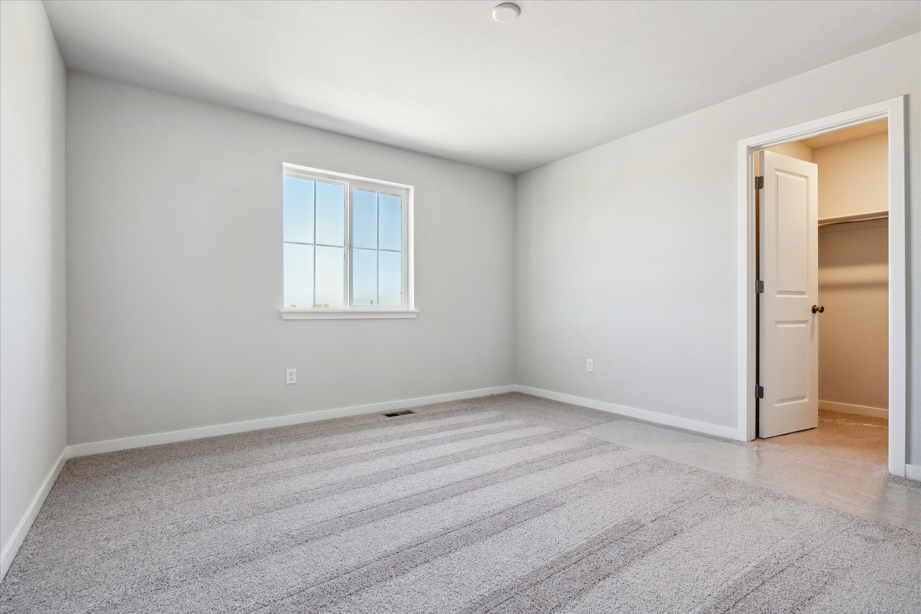 A room with a door and a window.