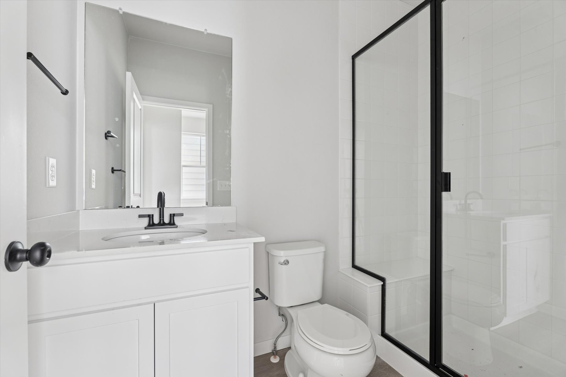 A bathroom with a toilet and sink.