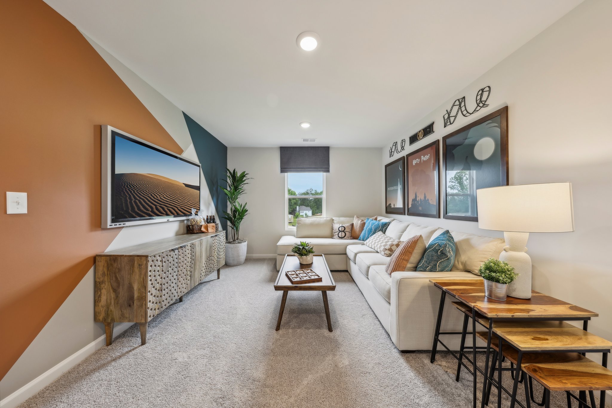 A living room with a large tv.