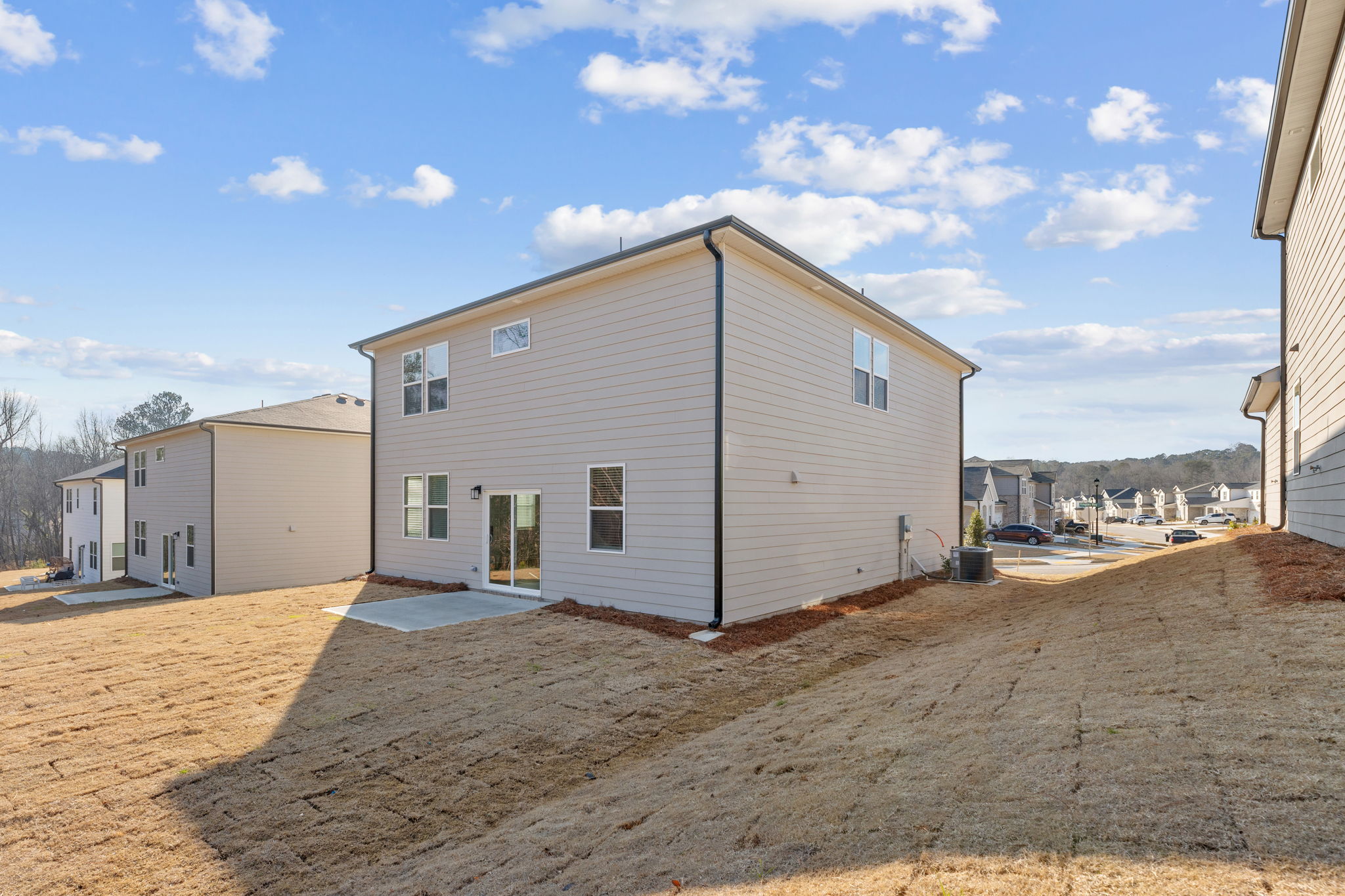 A building with a dirt lot.