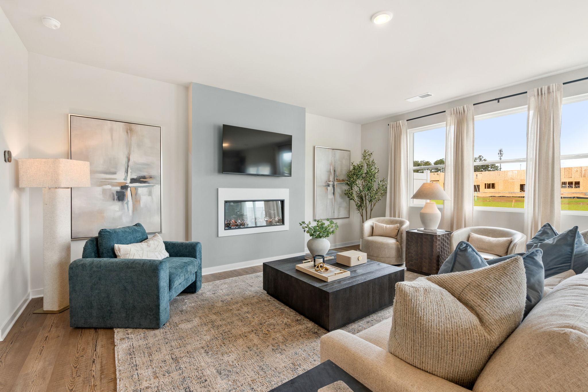 A living room with a large window.