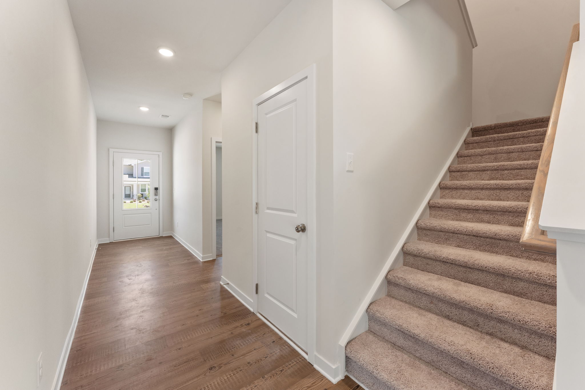 A hallway with white doors.