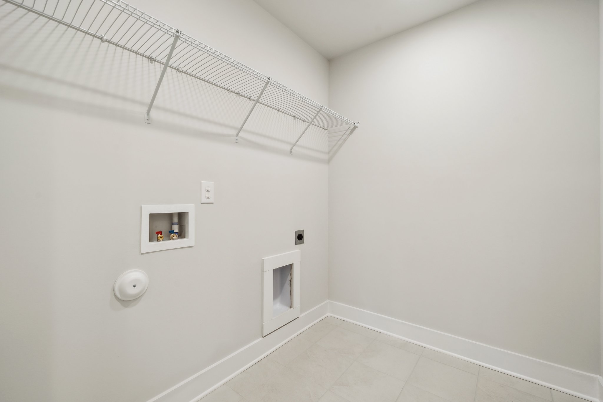 A white room with a white wall.