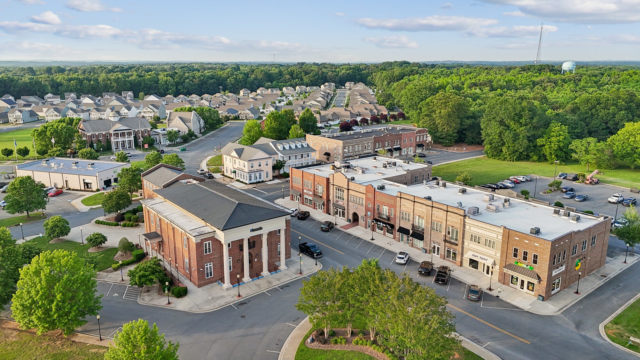 A large building with a parking lot.