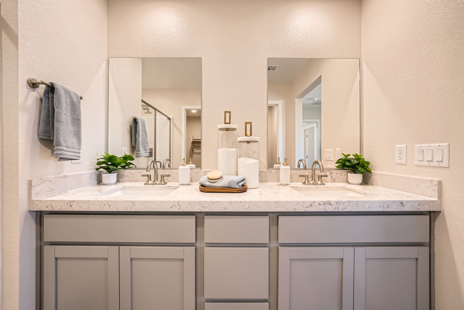 A bathroom with a large mirror.