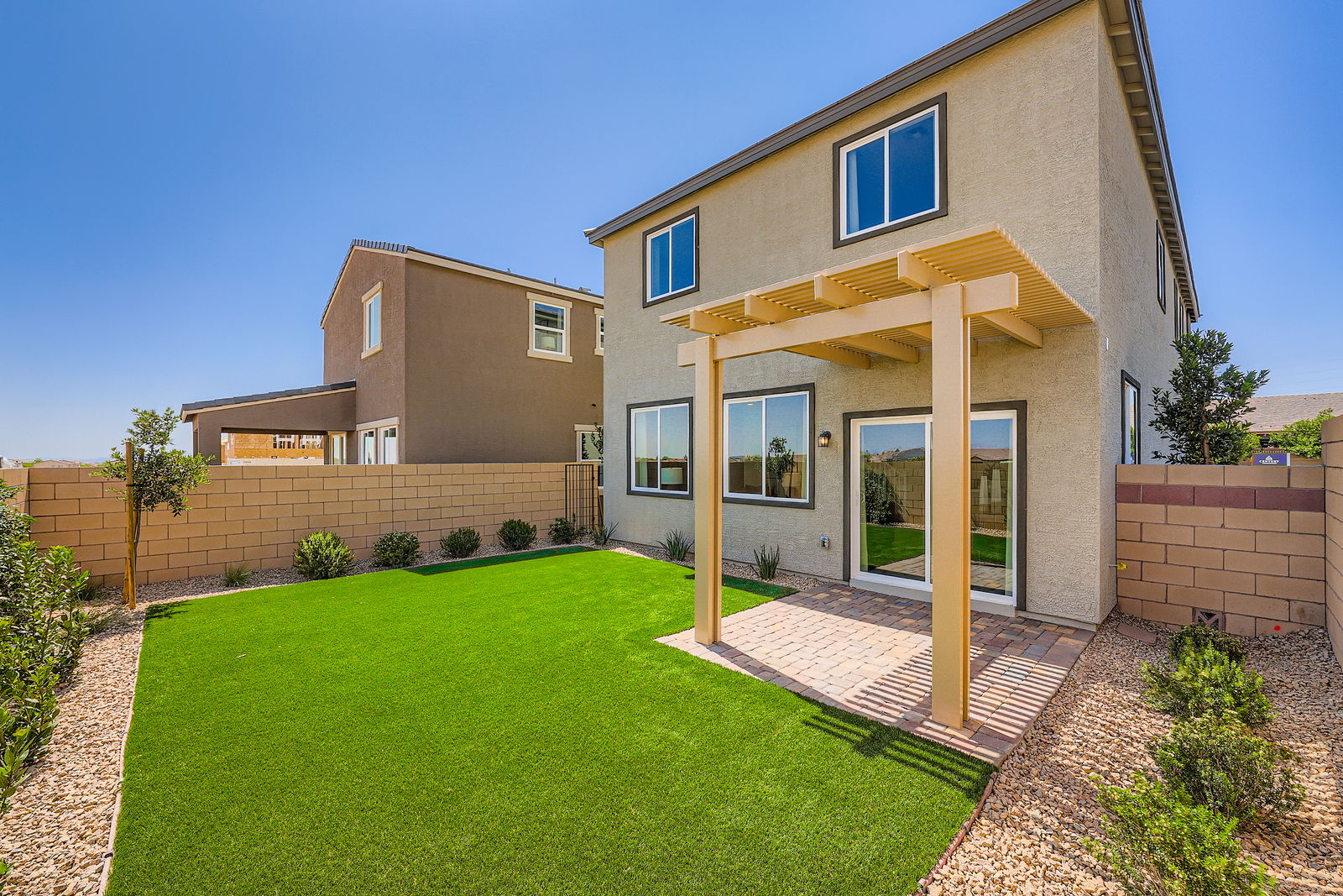 A house with a green lawn.