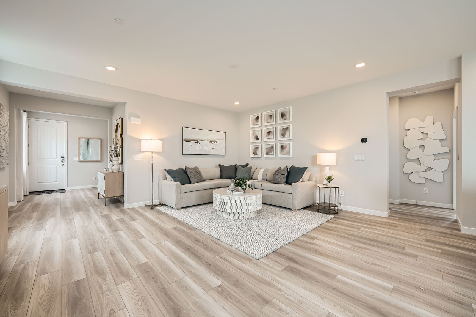 A living room with a wood floor.