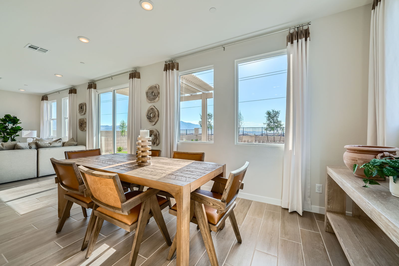 A dining room with a large window.