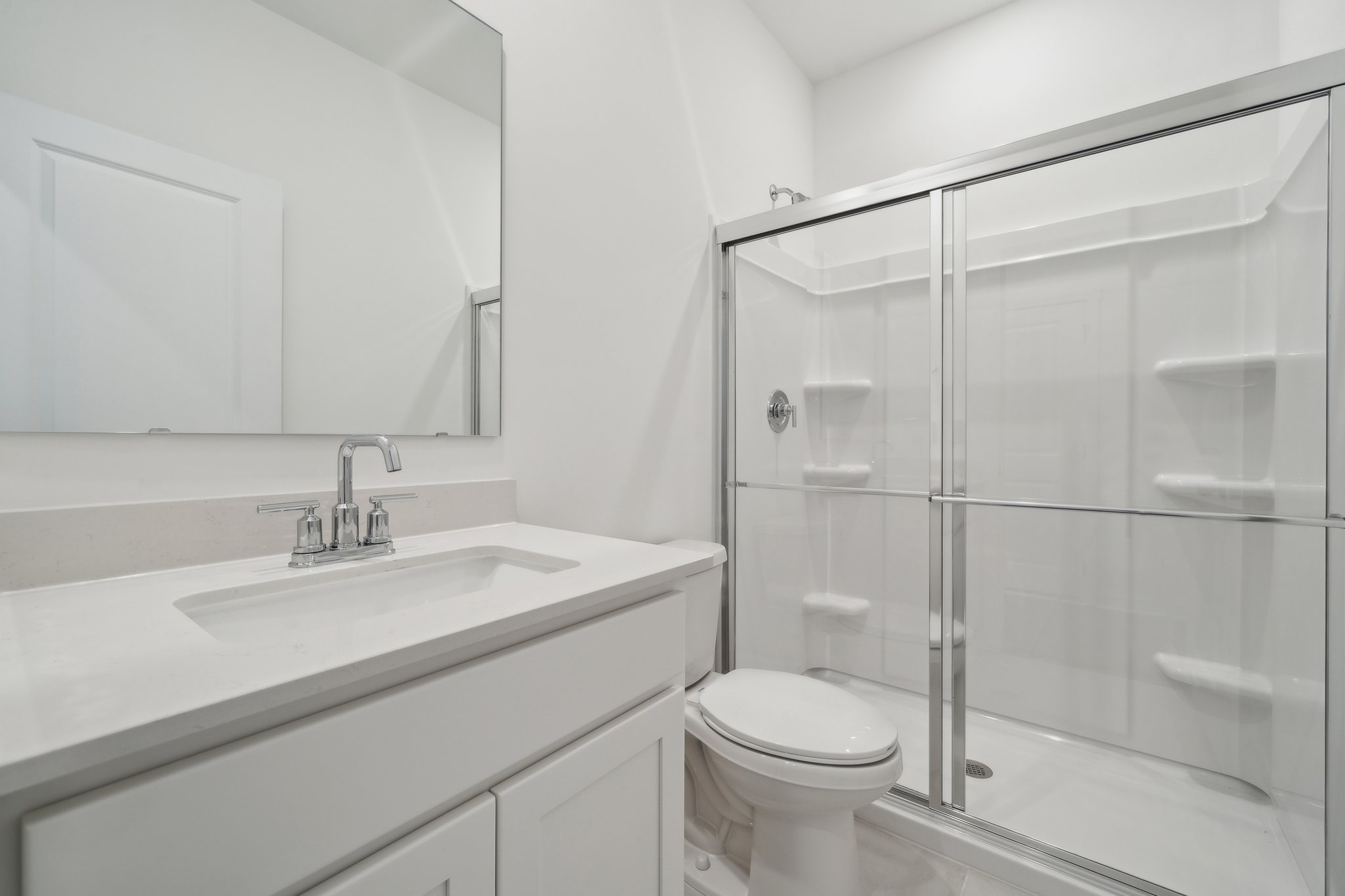 A bathroom with a glass shower.