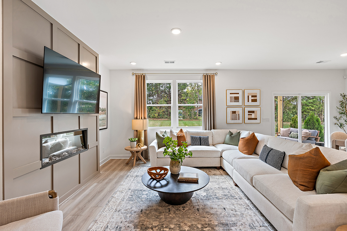 A living room with a large tv and a couch.