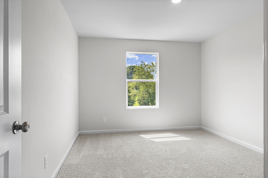 A room with a window and a door.