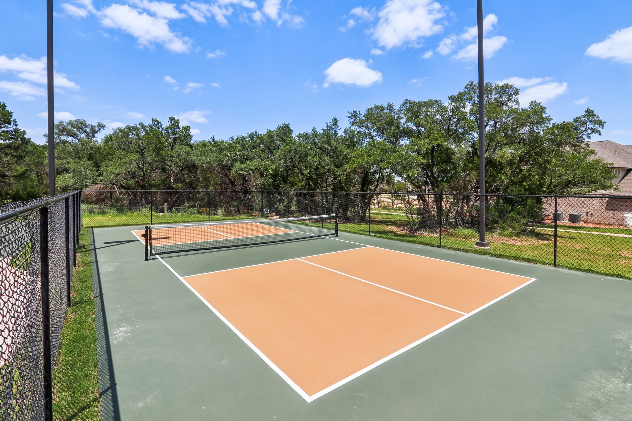 A tennis court with a net.