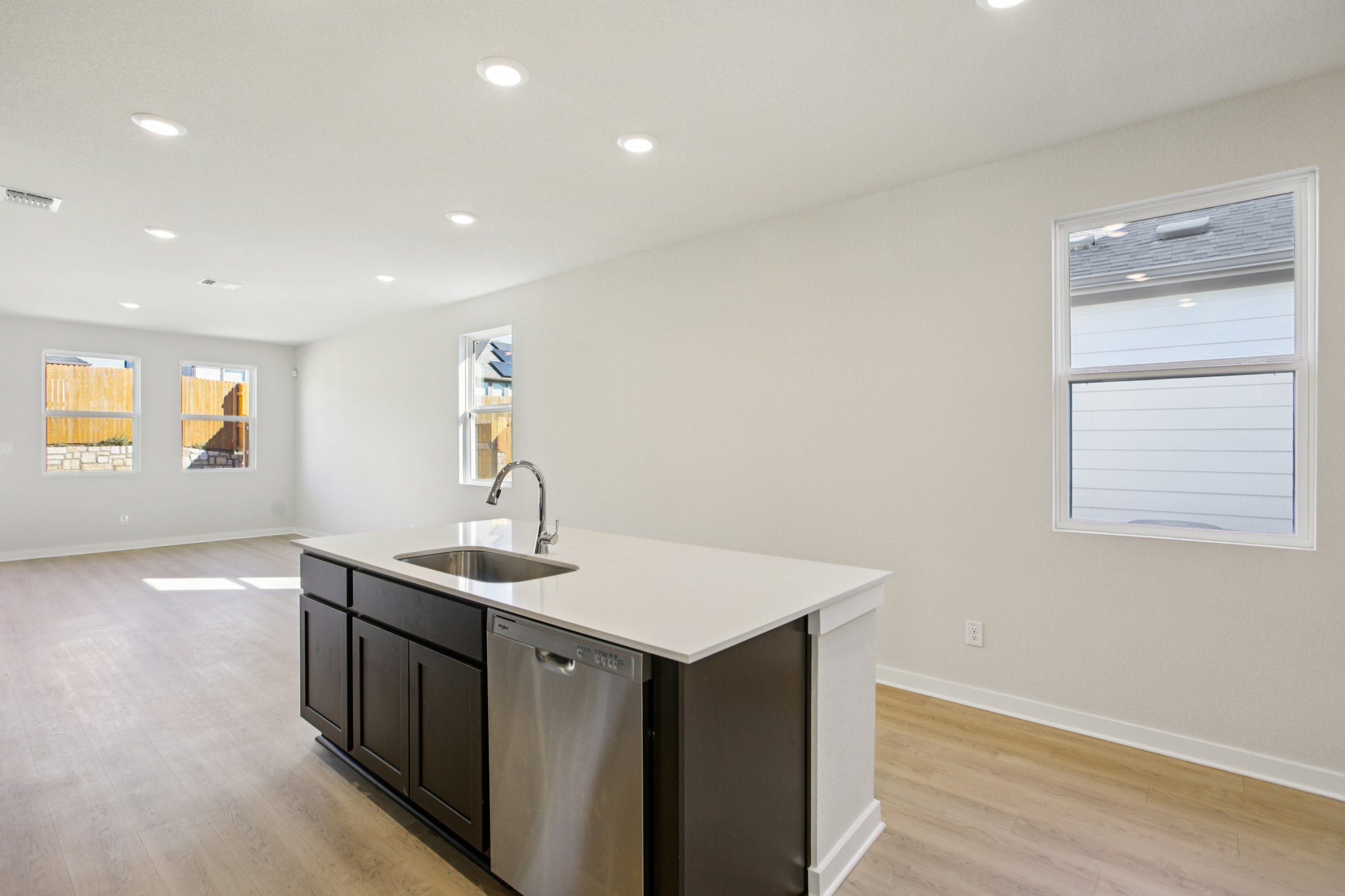 A kitchen with a sink and cabinets.
