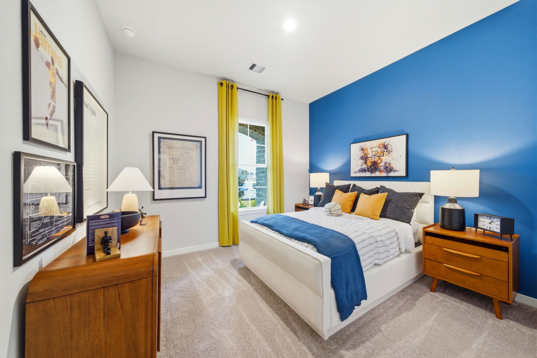 A bedroom with a bed and a dresser.