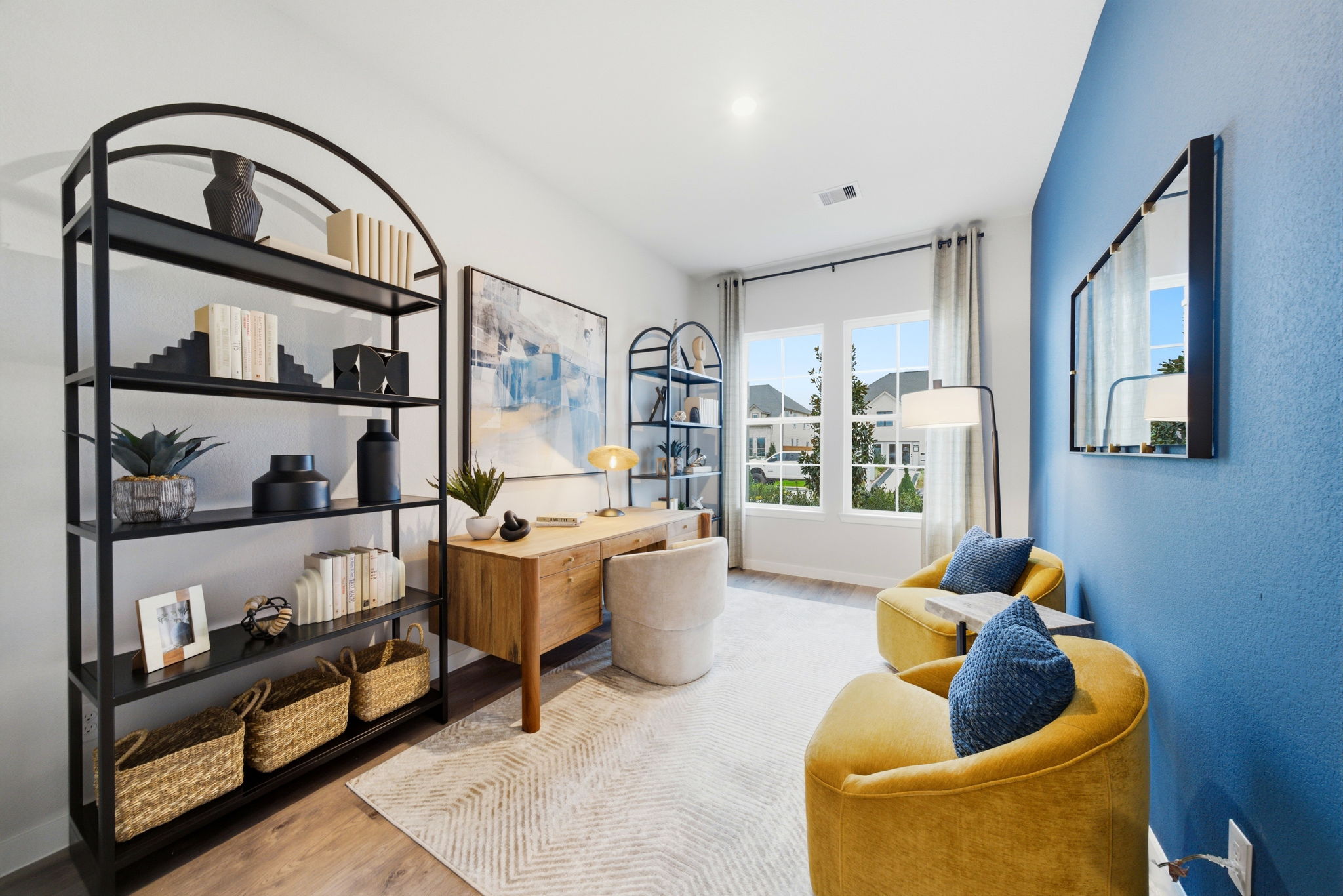 A living room with a blue wall.