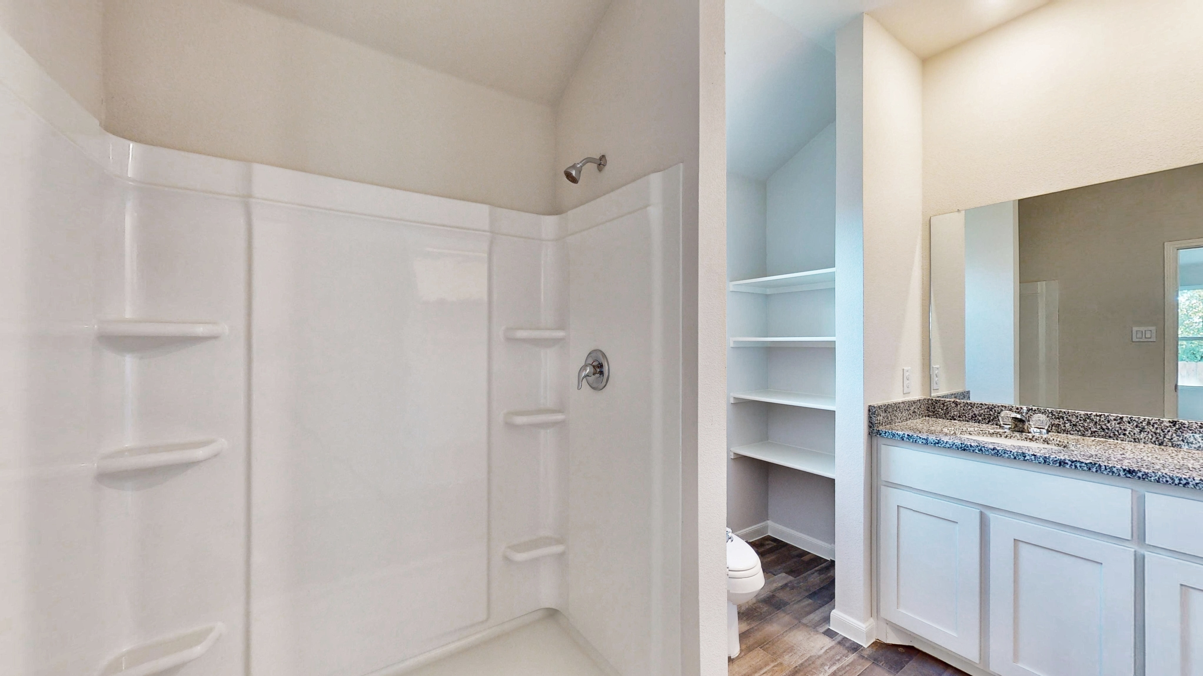 A bathroom with a glass shower.