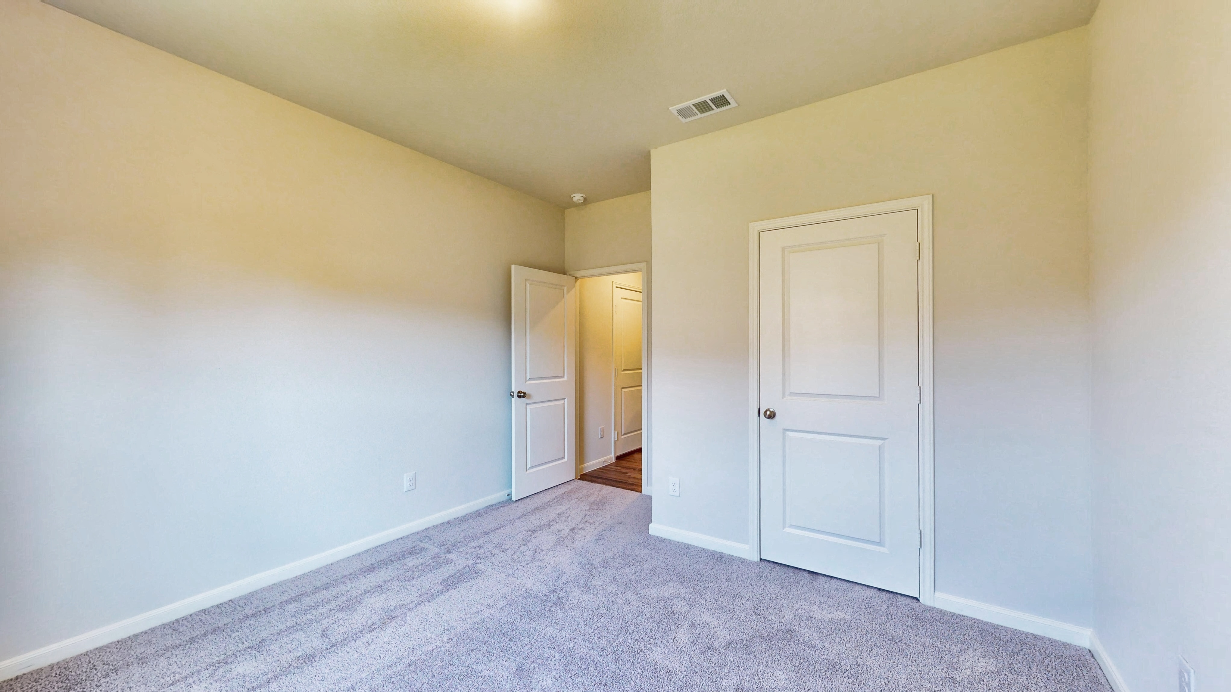 A room with white doors.