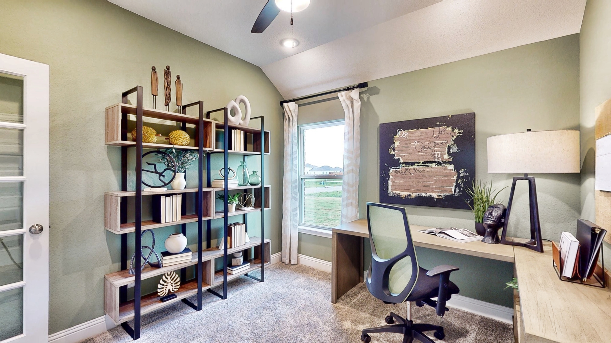 A room with a desk and a chair.