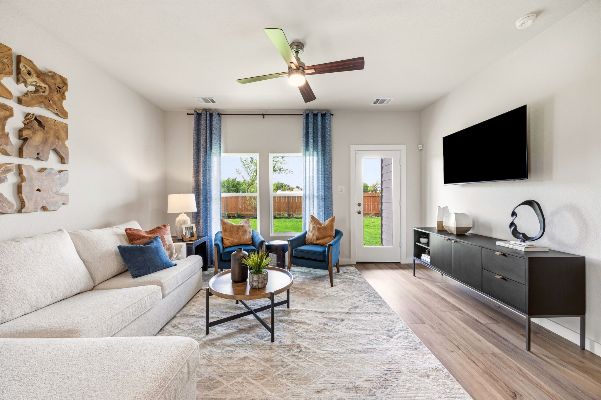A living room with a tv and couches.