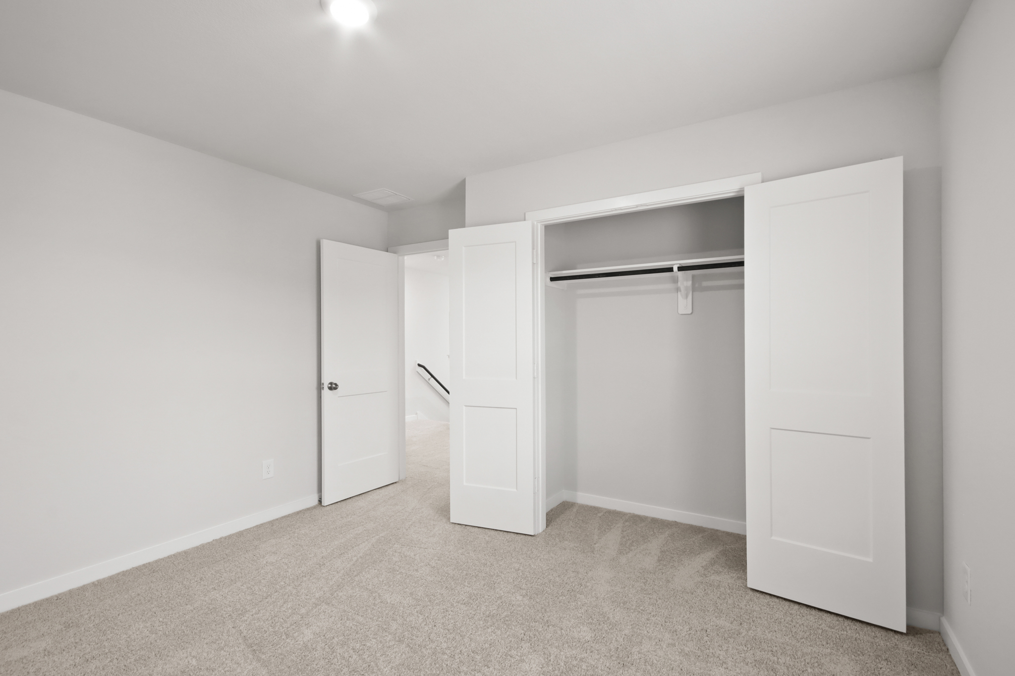 A room with white doors.