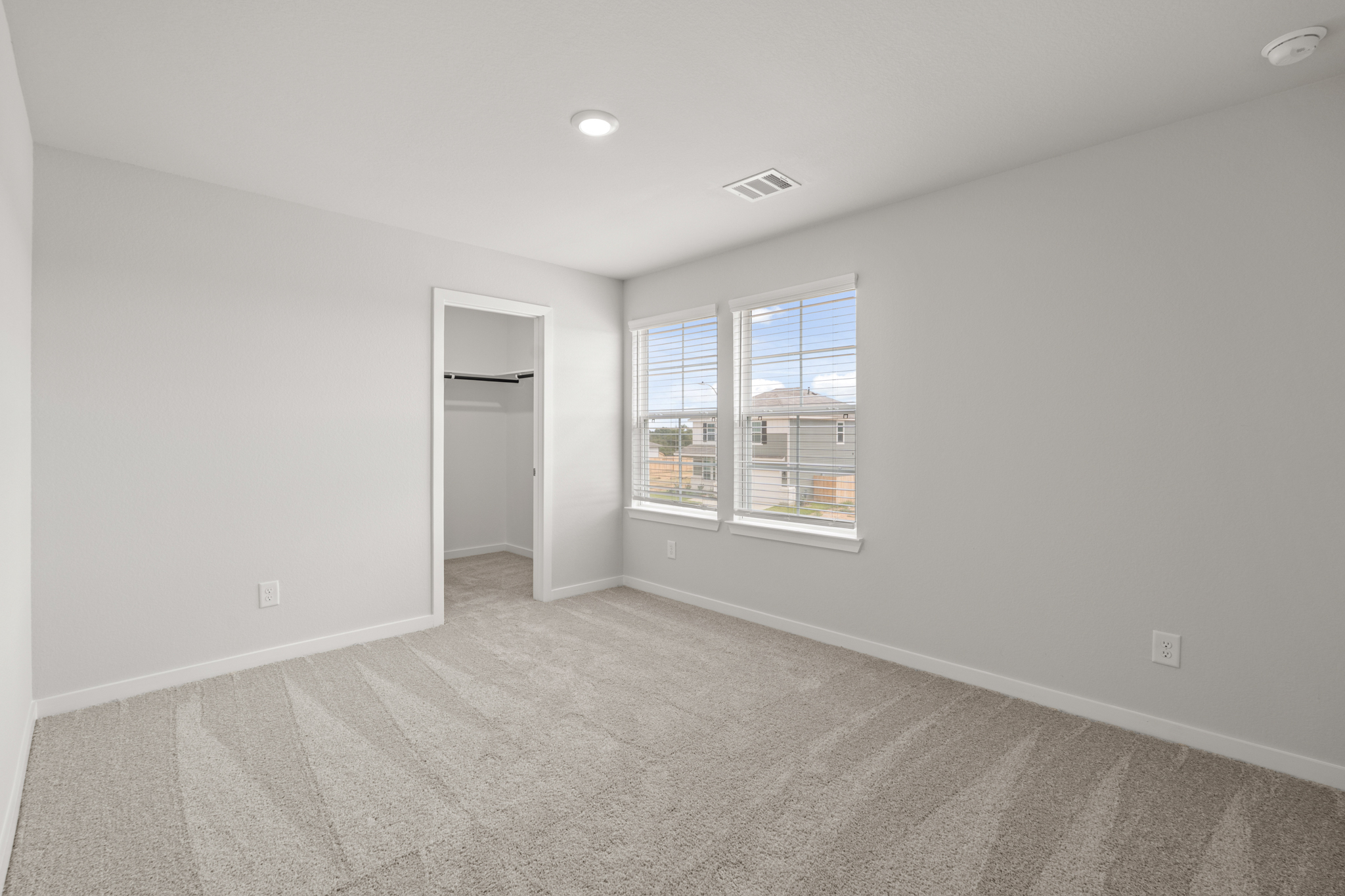 A room with a window and a door.