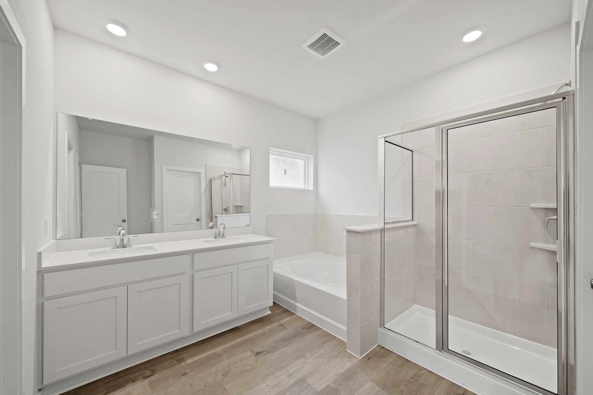 A bathroom with a glass shower.