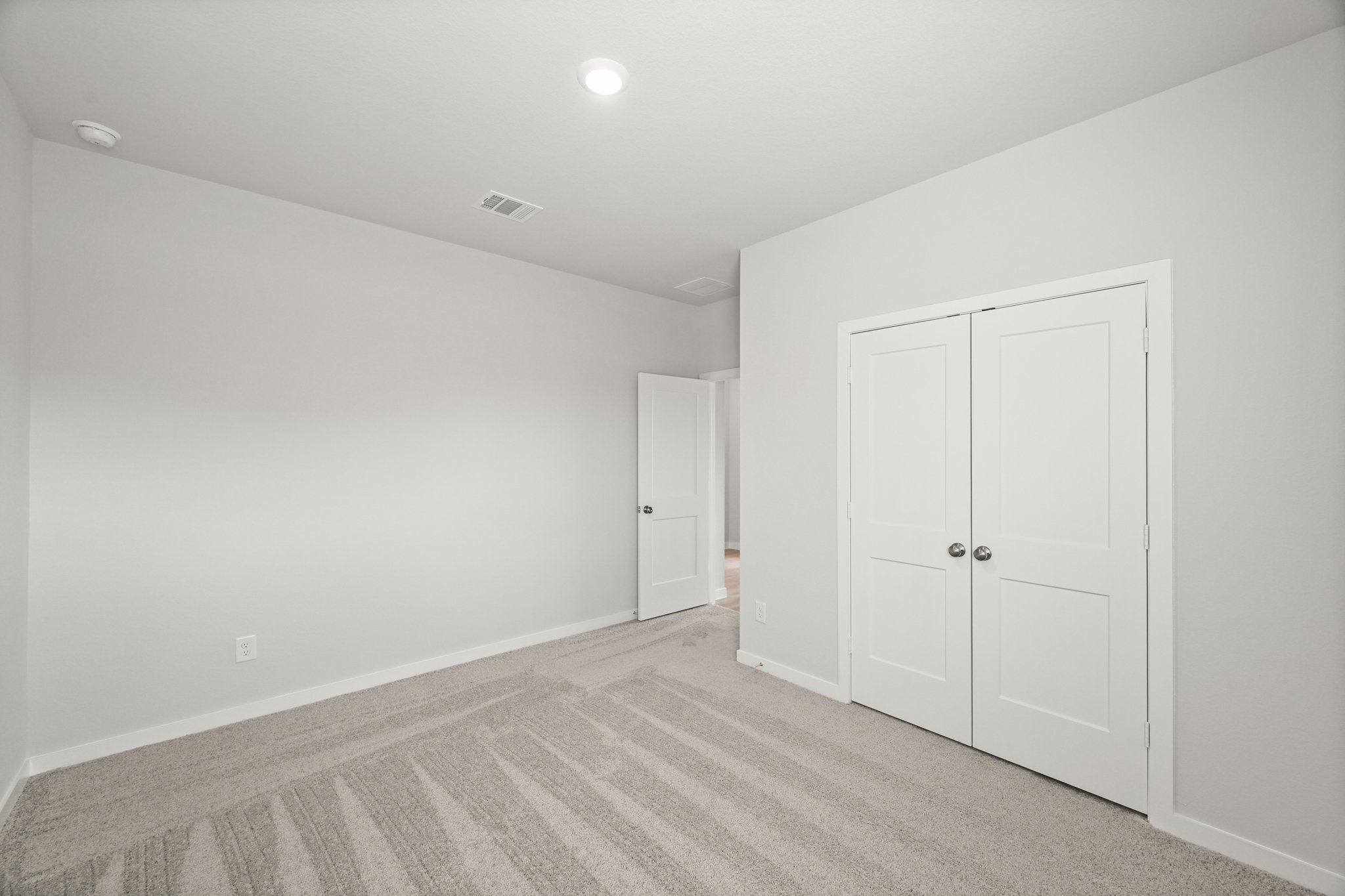 A room with white doors.