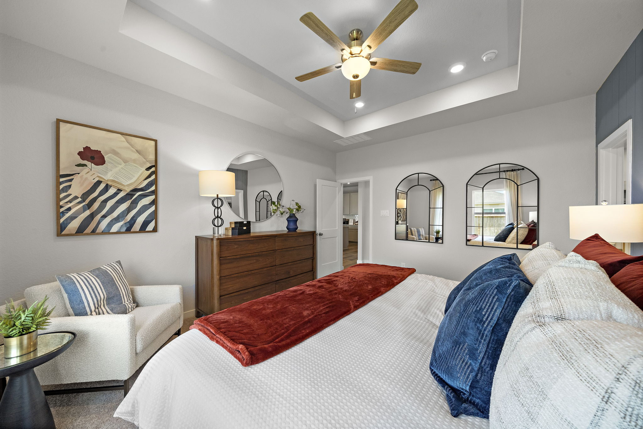 A bedroom with a bed and a couch.