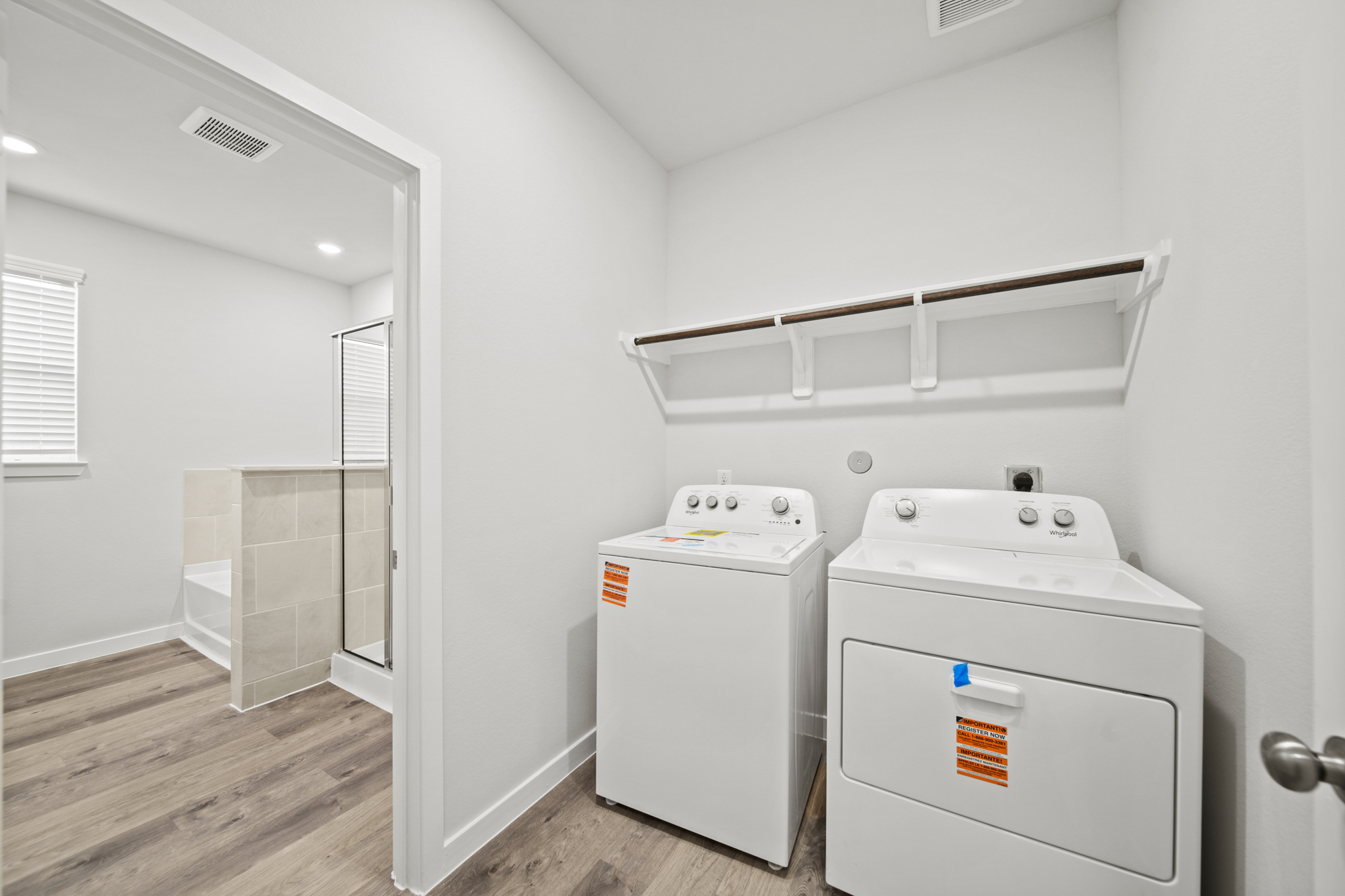 A washer and dryer in a room.