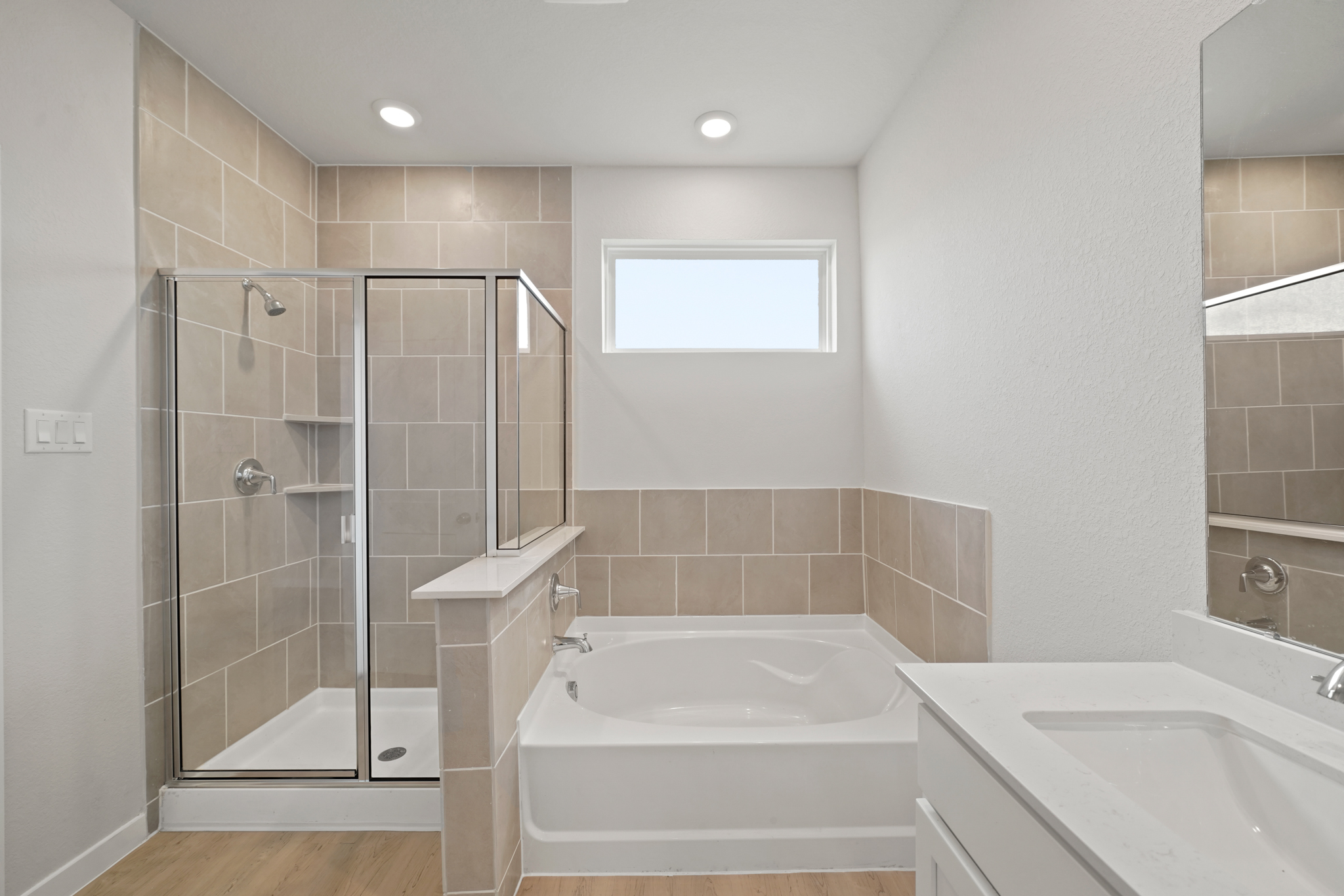 A bathroom with a glass shower.