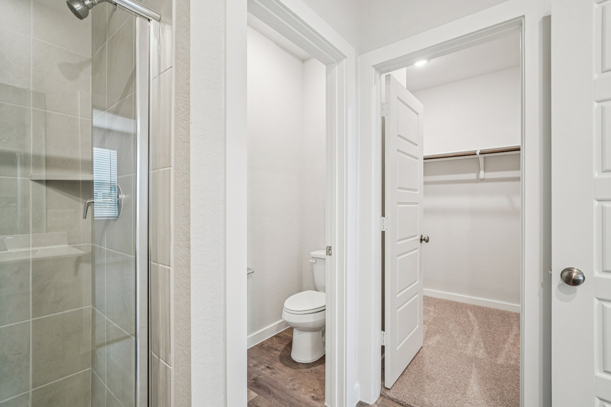 A bathroom with a glass shower.