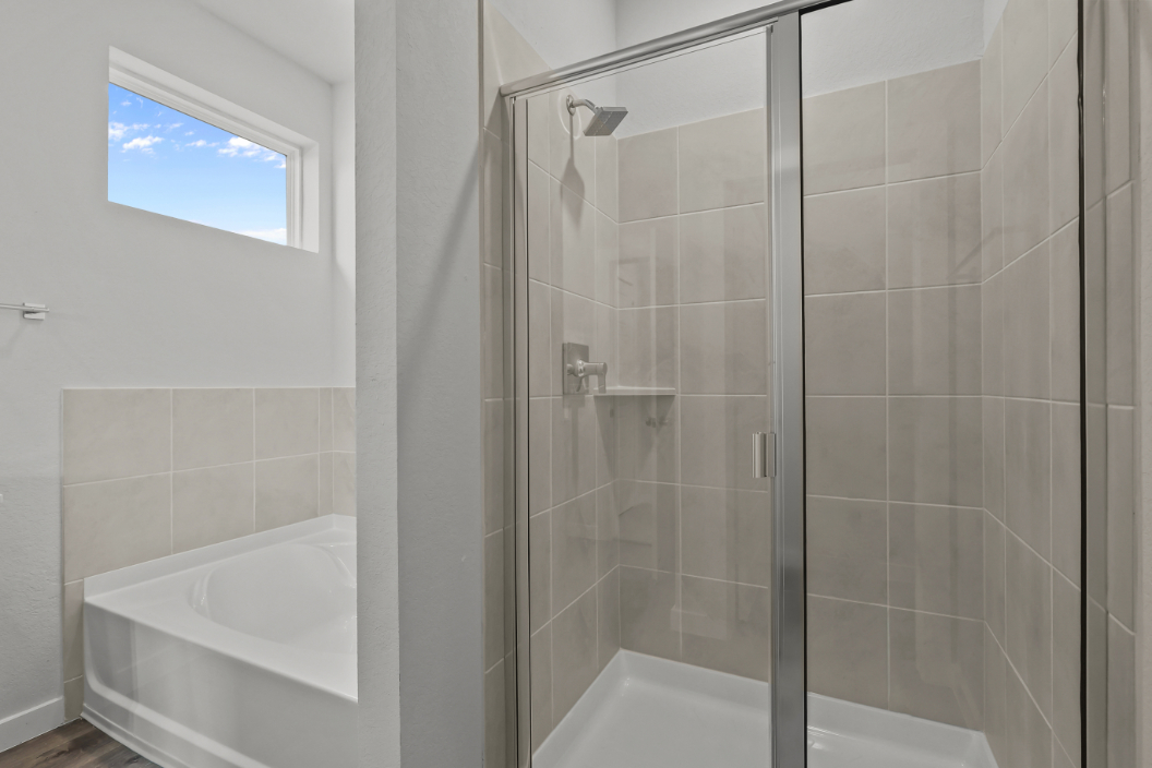 A bathroom with a glass shower.