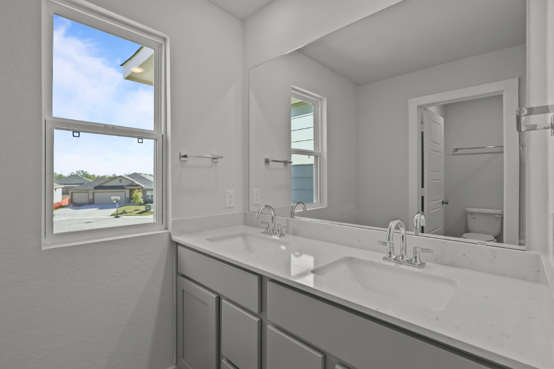 A bathroom with a large window.