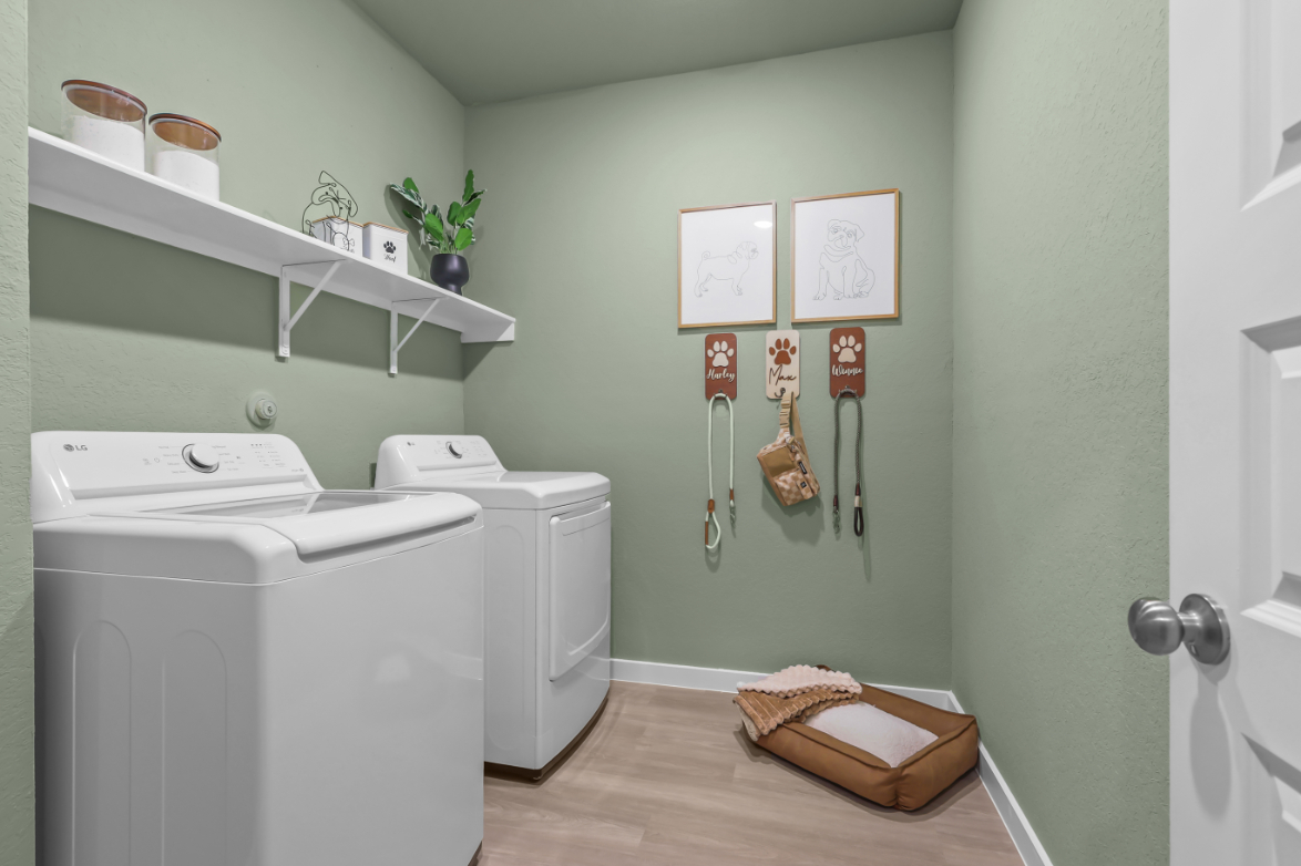 A laundry room with a washer and dryer.